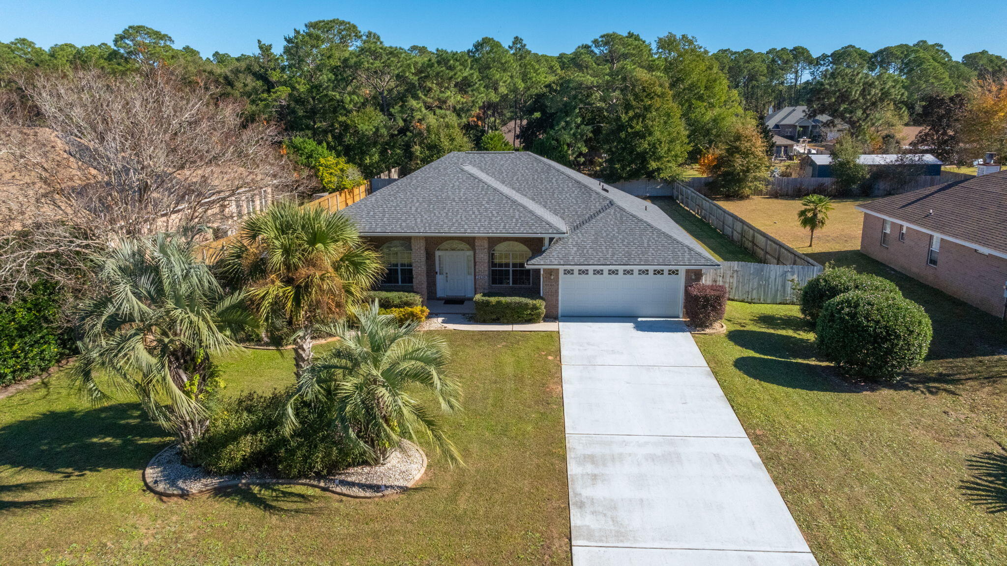 Immaculate well taken care of home ready for its new family. Roof 2022, HVAC 2017, Water Heater 2017, Garage Door 2020, Washer/dryer 2017, Stove, Microwave, Refrigerator, dishwasher, 2020. Septic was cleaned in 2022. Garage was customized to fit a full size crew cab truck (currently holds a car and F150 protecting them from the elements.) Grand open front porch with stamped concrete porch and sidewalk, painted driveway. Step in and to the left you have a flex room which could easily be converted to a 5th bedroom, to the right is the dining room. Huge living room great for entertaining family and friends. Kitchen provides ample cabinet and granite counter space for all your cooking needs along with stainless steel appliances. Split floor plan provides privacy. Master bath has custom walk in shower,dual vanity, dual walk in closets, and whirlpool jet tub. Need more space, check out the massive heated and cooled Florida room providing the ideal space for a man cave, entertainment area, and or just a relaxing place to enjoy your morning coffee. Jacuzzi tub included. Massive fenced in backyard ready for the kids and family dog to play. Maintain all the custom landscaping with your very own sprinkler system ( new lawn pump and timer). Seller is in process of packing for a quick move so thats what you will see in the pictures and during the showing. Located in Hidden Creek subdivision near a golf course. 