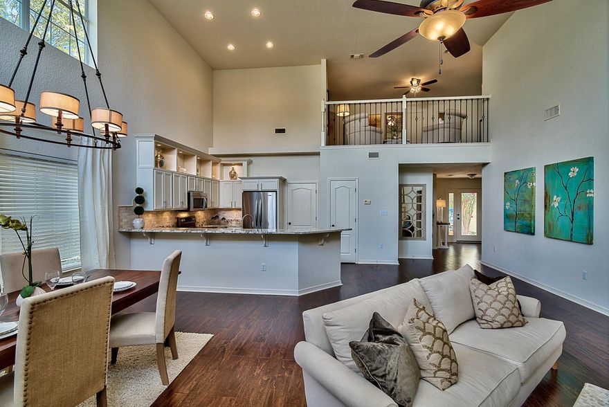 RENOVATED lake front home in Gated community. Like new home with luxurious finishes. Peacock paver front porch, hardwood and travertine flooring, all new stainless steel kitchen aid appliances, beautiful granite in kitchen and baths, cul-de-sac location, private covered back porch overlooking lake. Soaring ceilings, hurricane shutters, large bedrooms with walk in closets, spacious loft area perfect for office and additional living space. Wont Last.