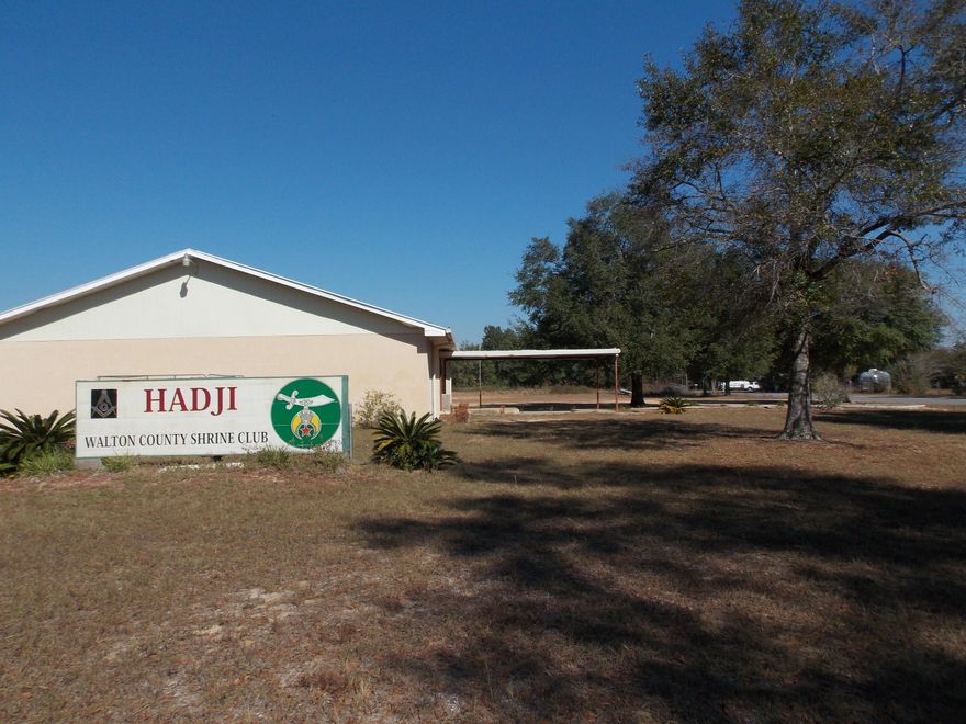 OPPORTUNITY!!! 12 ACRES WITH 4892 SQ. FOOT BUILDING READY FOR OCCUPANCY. Handicap accessible, restrooms, full kitchen, storage room and additional storage building. Possibilities are many for the use of this building. This property is currently zoned Rural Village with a current land use of Civic. Walton County says nothing would be required to continue use as a civic minded venture and commercial use should not be difficult to obtain. Information obtained from Walton County Planning. 2 legal lots of record make up this parcel, so possible sale of half of land could add additional value to buyers. Call today and let's see if this is the right place for your venture. (Buyer should verify all pertinent information to their satisfaction.)