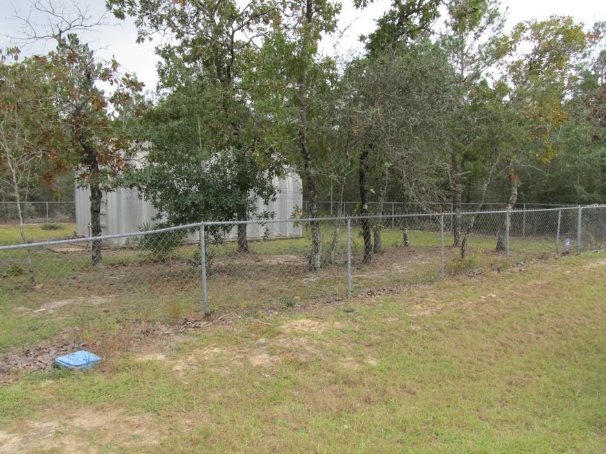 Improved corner lot with all utilities in place.  If you are ready to move to the Mossy Head area in North Walton County, then this parcel is perfect.  Property features 16 x 22 metal workshop complete with concrete pad and electricity, 18 x 30 carport cover for your RV or vehicle, chain link fencing around the perimeter of property, and paved road frontage.  Septic pert test reflects usage for a 3/2 if desired.  All the improvements have been done for you, so it is ready for your next home.   Beaver Lake right around the corner.  All the hard work as been done for you.  Schedule your showing today.