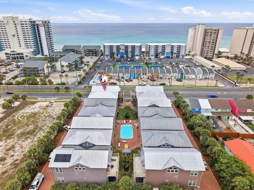 Turnkey short-term rental just steps from the beach! This fully furnished 4-bedroom, 4-bath beach home is ideally positioned near Beach Access 12, offering strong rental potential in one of Panama City Beach's most sought-after locations. With multiple levels, spacious layouts, and sleeping capacity for larger groups, this property is designed to maximize occupancy and guest appeal.A standout feature is the first-floor studio suite with its own living area, kitchenette, and full bath--perfect for added rental flexibility, lockout capability, or hosting multiple groups. The main living area features an open-concept design with granite countertops, stainless appliances, and generous gathering space, along with covered decks on multiple levels to enhance the guest experience. The oversized primary suite includes a jetted tub, double vanities, and a separate shower, while additional bedrooms and baths provide ample accommodations for high guest turnover. A rare two-car garage adds extra value for owners and guests alike.
Located in the Panama Dunes area with short-term rentals allowed, this property is minutes from restaurants, shopping, and St. Andrews State Park--ensuring consistent year-round demand. Low-maintenance construction, a community pool, and proximity to the beach make this a strong addition to any portfolio.
High occupancy potential, flexible layout, and prime location.