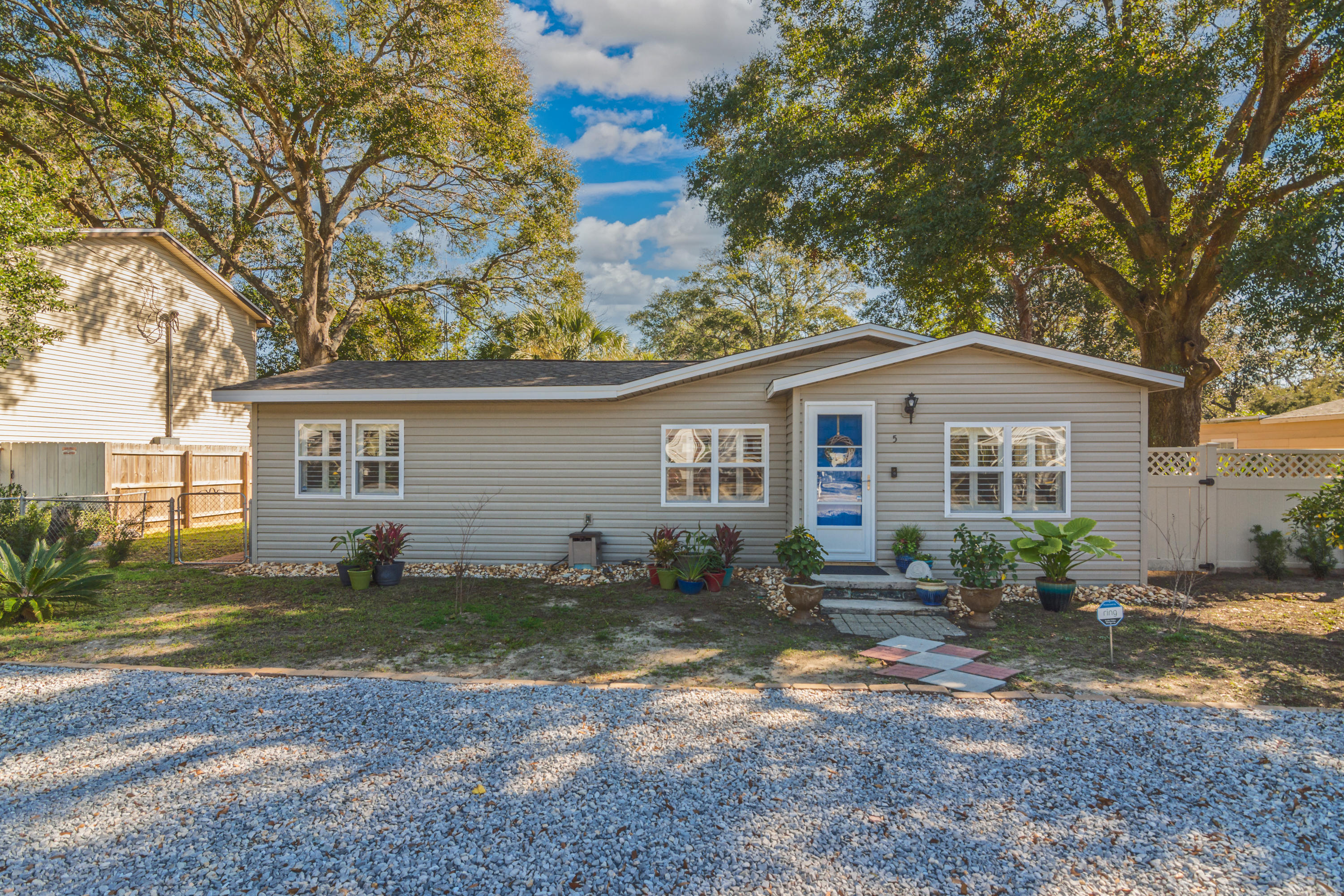 This charming and completely renovated downtown cottage is located in the most sought-after neighborhood of Elliott Point. Just a few blocks down from the water and from the popular Brooks St. area, this home is in the perfect location for water lovers. There are multiple water access points, fishing holes, a neighborhood boat ramp, sandy beach access which is perfect for launching kayaks and paddle boards and just a few minutes over the brooks bridge, and you will be at our gorgeous white sand beaches on Okaloosa Island. This 3/2 home features a great split floorplan which a spacious floorplan.From the moment you walk through the front door you will find yourself in the well-designed living room. You will love the split floor plan with the master bedroom on the left & additional two
