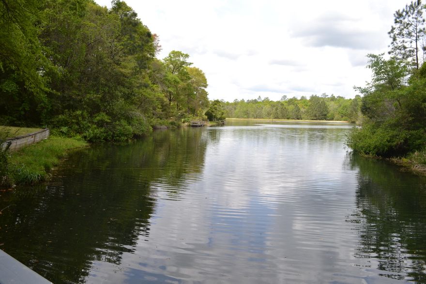 Living the lake life! 103 Mohawk Trail provides the space and scenery for the perfect place to call your new home! The entire home has just been professionally repainted, beautiful bamboo floors throughout the living space along with tile and some carpet. The living areas are large, cathedral ceilings, fireplace with new gas logs, big bedrooms and an office space that can easily be turned into a 4th bedroom. The master delivers a picturesque view of the lake! This home was built to entertain with a Florida room just off the living room, then an open deck providing a peaceful stroll down the walkway to your lakefront view. Kayak across the lake to a beautiful park or just sit on your dock and do some fishing. It is a must see! Re-roofed in 2009, AC 2011. Home Warranty and Survey available.