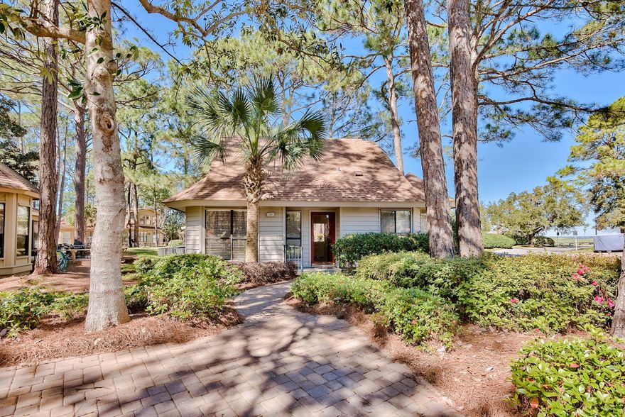This lovely cottage is a rare find in the Fairways of Sandestin Golf & Beach Resort, a gated golf course community. Tucked away on a wooded corner lot, you will feel a sense of seclusion. This home is located just off the 8th tee box of the Links golf course. The large screened porch and deck provide a beautiful view of the 8th hole which ends dramatically at the edge of the Choctawhatchee Bay. Sunset views on the bay are spectacular and are a short walk from your back door. You are a short distance by car or golf cart from all of the fabulous amenities Sandestin has to offer. The owners have updated all plumbing in the house, and both the exterior and interior of the home have been freshly painted. Roof was replaced in 2016 and HVAC in 2013. The master bath was totally remodeled