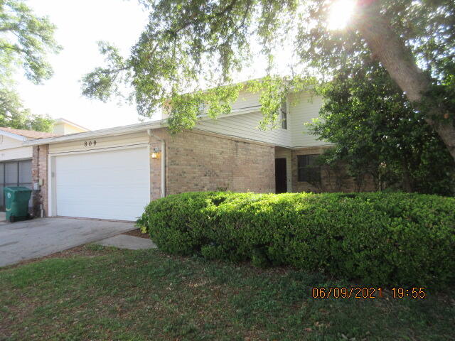 Popular Donlabrook Gardyns, a community of homeowners that lovingly maintain their homes. Just minutes away from WalMart, Sam's Club, Lowes and Kohls. Across the street from the Fort Walton Beach Medical Center as well. There is a den and full bath downstairs, this could be used as a bedroom if preferred. Tall ceilings and fireplace in the great room. The dining room is open to the great room and there is a breakfast nook in the kitchen. Two full baths upstairs. New roof 2021, all new interior paint, new laminate floors and new carpet. Washer/dryer/trash . compactor not warranted. Tons of storage and over sized detached garage. This is a must see!!!