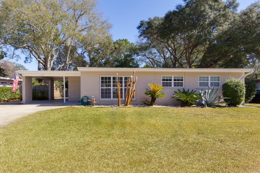 If you are looking for a 3 bedroom home in Elliott Point, look no further! This pristine home has been lovingly upgraded and maintained. Absolutely nothing needs to be done and no detail has been overlooked. Walk through the front door and see the open living room and kitchen area. Speaking of kitchen, wow!! Dark wood cabinets, stunning countertops and all stainless steel appliances. As you wander down the hallway, you come upon the bathroom that has also been remodeled. The entire home has tile flooring so you won't find carpet anywhere! This home even has a Rinnai tankless hot water heater for endless hot showers!! Even the pets in the family will be spoiled with a dog door in place and their own outdoor drinking station. Did somebody say outside? Yes!!