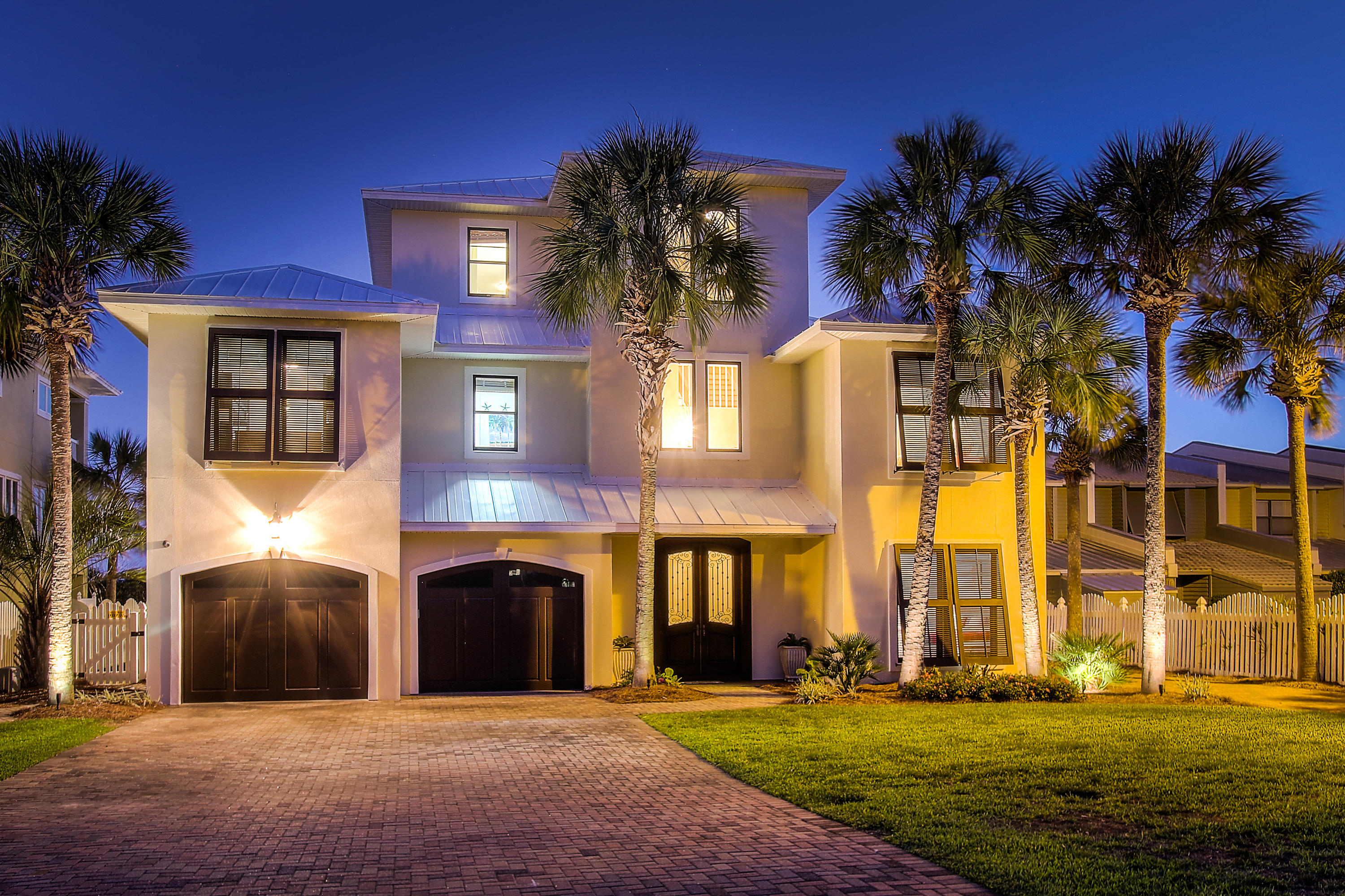 HOW ABOUT 36 PALM TREES ON 80' OF GULF FRONT FILL ALMOST 1/2 ACRE, ROOM FOR 6-8 CARS W/ FRESH EXTERIOR PAINT? Start making MEMORIES IN THIS ULTIMATE FAMILY BEACH HOUSE! HUGE GULF FRONT HEATED POOL & FABULOUS VIEWS. 7 BR/7.5 BA home has ROOM FOR THE ENTIRE FAMILY! First floor can be 'LOCK-OUT' w/ 2BR/2BA, large LIVING ROOM w/ full kitchen, & private entrance, right on the pool. 2nd floor has HUGE LIVING AREA w/ remodeled KITCHEN, 2 wings w/ 2BR/2BA on each side of LIVING area, (PLENTY OF ROOM for ALL the GRANDS!) MASTER SUITE is the ENTIRE 3rd floor w/ SITTING AREA, WET BAR & COVERED BALCONY overlooking POOL & GULF. PRIVATE WALK-OVER TO THE BEACH. HUGE GARAGE w/ parking for 3 cars & ALL YOUR TOYS! PARK 6-8 cars in drive