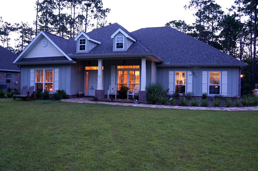 This luxurious 5 BR/3 BA home is located just minutes from Florida's famous Beaches of 30A. Designed for beauty and sustainability with hardwood floors, decorative tray-style ceilings, interior columns, and a kitchen outfitted with solid wood cabinets and granite counter tops. Modern upgrades include Smart Air Conditioning with mobile management, security system, irrigation well, large underground propane tank, and a fire pit in the back yard. A dream home from the inside out!Please note that the owners have cut this price to rock bottom for a quick sale. It is a firm price -- requiring that the the buyer pay all closing costs.