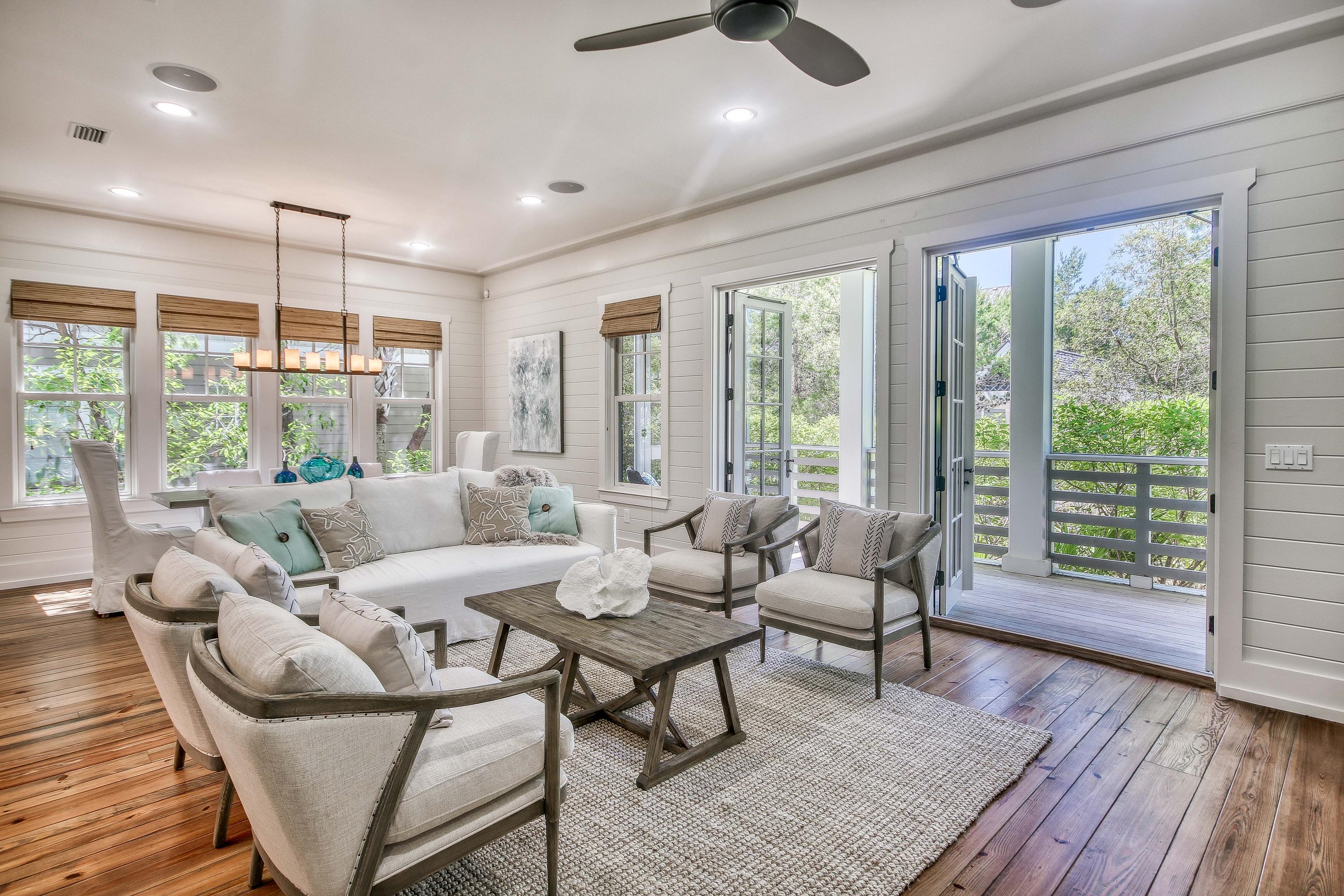 PROFESSIONAL DECORATED & NOW SOLD FURNISHED! This custom residence in the gated community of WaterSound Beach is sure to impress. Designed by Christ & Associates Architects this home fronts the coveted Puttering Park location. The interior selections are a refined sophistication & one immediately appreciates the skillful millwork of the wood trimmed walls, doors & cabinetry. The open dining & living area is accentuated by a custom fireplace with cypress mantle & double French doors that lead to a screened porch surrounded by the private park. The inviting gourmet kitchen with Viking appliances leaves no element overlooked. A guest bedroom with ensuite bath on the first level has its own private porch. The second floor master retreat includes shiplap walls, masonry fireplace &