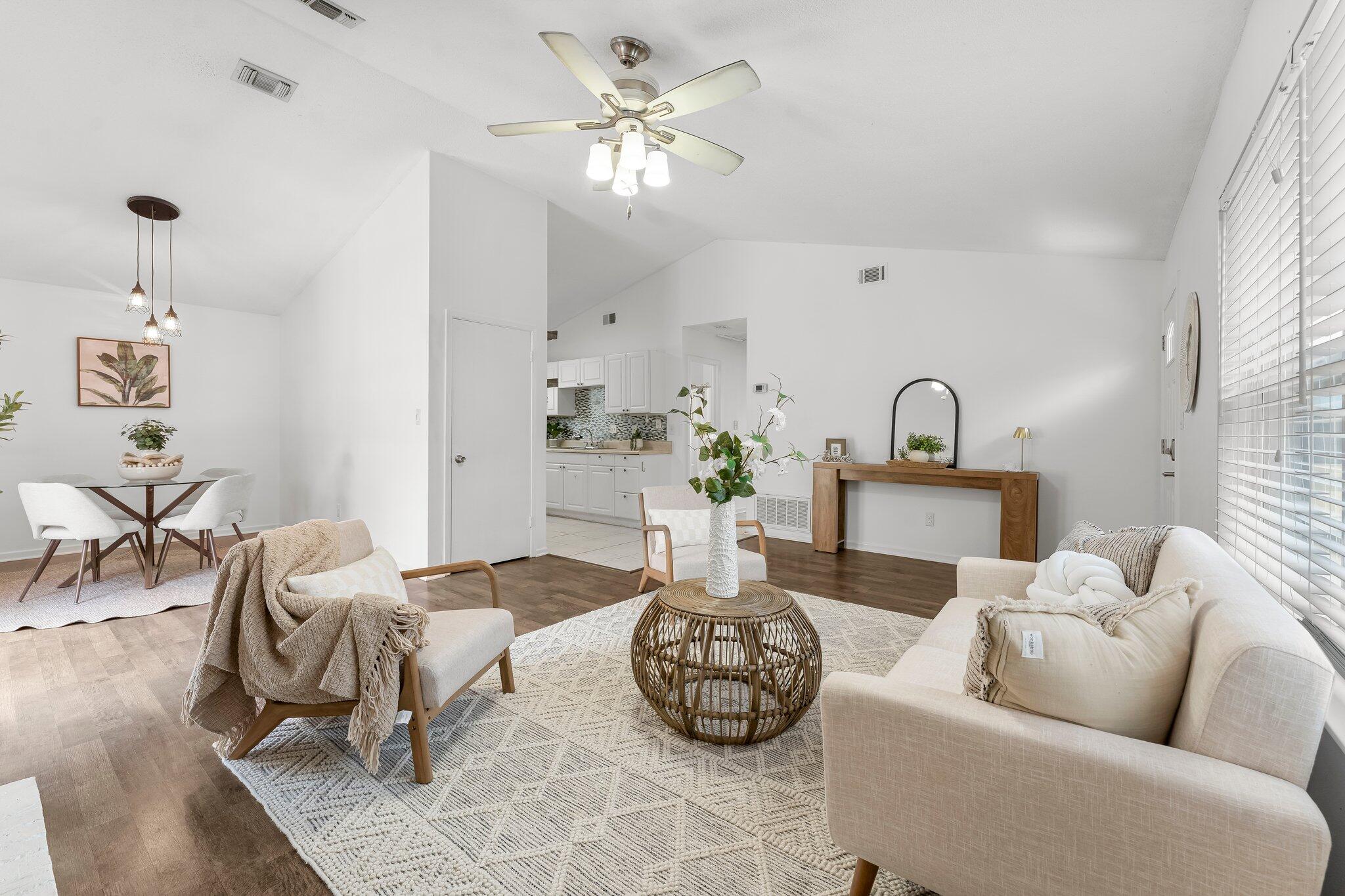 Check out this lovely updated home! Less than two miles from shops, entertainment, beaches, parks, and boat ramps--making this home perfectly located for fun in Destin.As soon as you walk in, you'll notice the vaulted ceilings and open layout that create a warm and inviting vibe. The living area features a cozy wood-burning fireplace and fresh laminate flooring.Down the hall, you'll find an updated bathroom with a stylish vanity, and a spacious spare bedroom with a big closet--perfect for your queen bed. The master bedroom at the end of the hall offers a walk-in closet and a nicely updated en-suite bathroom. Both bedrooms are spacious and include ceiling fans. Step outside to your welcoming patio and enjoy the fully fenced backyard, perfect for entertaining or kicking back in your own space.
The front of the home includes a spacious storage closet and there is additional storage space in the attic.