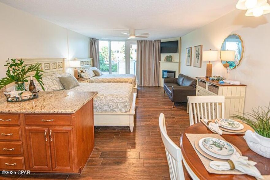 A Magnificent Ground Floor condo at the Beach. Excellent investment opportunity. Low cost of ownership with very high return. Everything is new, or recently updated to include HVAC, hot water heater, Custom Tile shower, designer toilet, new tile floors, granite counter tops in the kitchen and bath, soft close high end cabinets, new stove, refrigerator, and furniture that you will want to keep. A new fireplace. TV with Cable/wireless internet is included. Updated owners closet. Walk in, and smell the ''Newness.'' This unit has easy owner occupancy, with ease of living in a resort like environment. Not only the best priced unit on the ground floor at Top of The Gulf, it is beyond a doubt one of the nicest. Short Term Rentals are allowed, and these units do very well on the short term rental