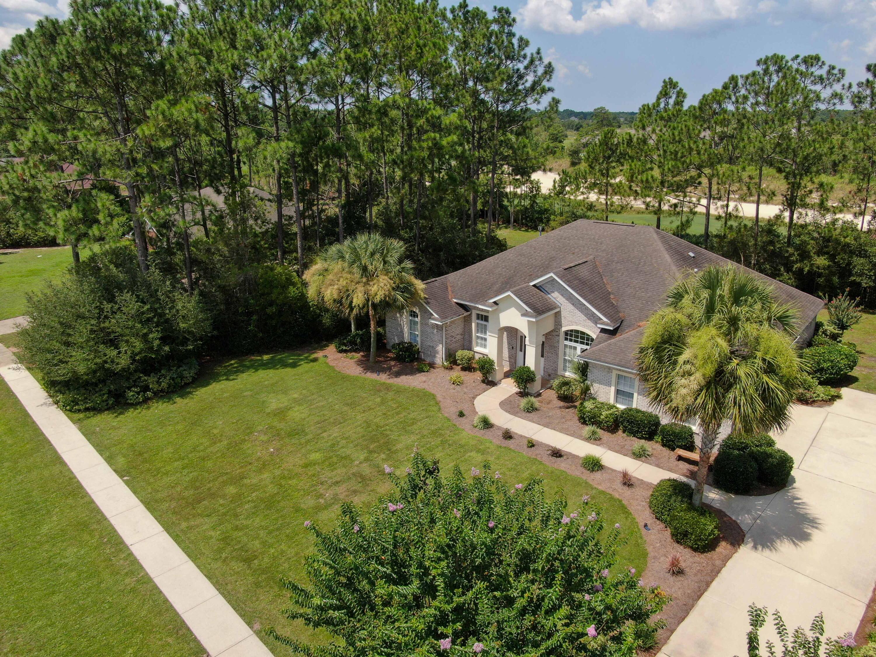 LEASE TO OWN AVAILABLE! Welcome to 431 Club House Drive E, Freeport, FL 32439, where luxury living meets the beauty of the golf course. This magnificent property boasts a tranquil retreat for golf enthusiasts and nature lovers alike. Step inside this opulent residence and be greeted by exquisite craftsmanship, high-end finishes, and an abundance of natural light.Indulge in the spacious gourmet kitchen equipped with great appliances, perfect for hosting elegant gatherings or intimate family meals. The open-concept living area seamlessly blends indoor and outdoor spaces, inviting you to relish in the picturesque sunsets from the incredible sunroom or your private terrace.
