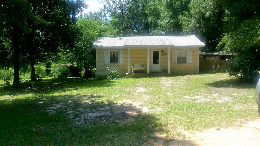 This older, yet lovingly maintained home, awaits a new owner. This charming home may make you feel like you're living in the country, but it is closely located to shopping, schools and all the amenities of the city. Home sits on a large lot and boasts 3 bedrooms and 1 full bathroom - with a recently added easy access shower. A multi-purpose storage room (includes additional toilet area) and an enclosed porch, with utility room sits off the master bedroom and eat in kitchen areas. Backyard sheds, washer, dryer and refrigerator will convey. New AC unit installed within the last 2 years. Property is being Sold As-Is. Home will not qualify for most financing. Outdated wiring. Buyer to verify all information deemed important. Call today and schedule your private showing of this cozy home