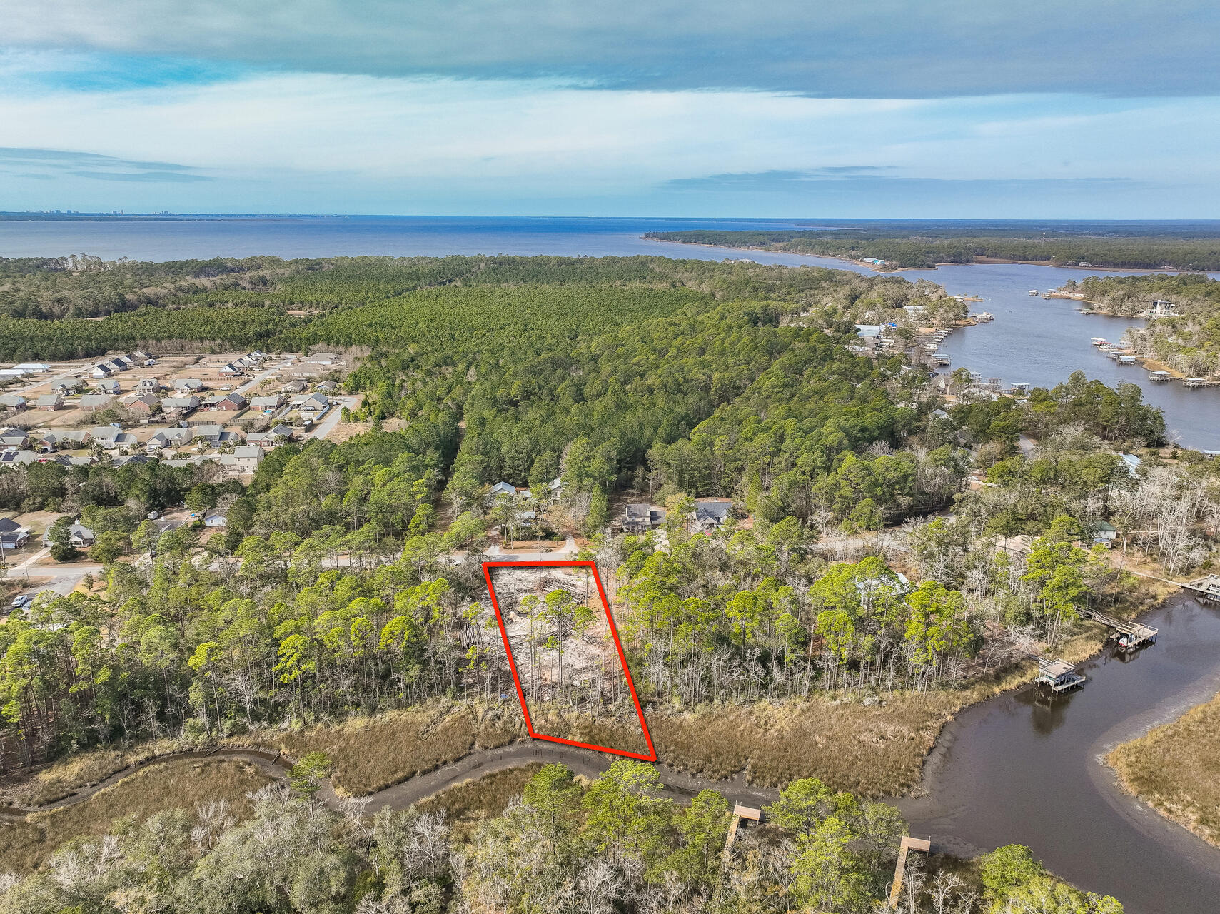 Grab this rare chance to own a waterfront lot on Mallet Bayou, ideal for building your dream home. Enjoy 90+ feet of beautiful water frontage, and a scenic mix of oak and pine trees - perfect for those who love being near the water. Conveniently located near U.S. Hwy 331 and a new county park with a boat ramp, this lot offers both tranquility and accessibility. Schedule a private showing to see the possibilities for yourself. Don't wait, this kind of lot doesn't come up often!