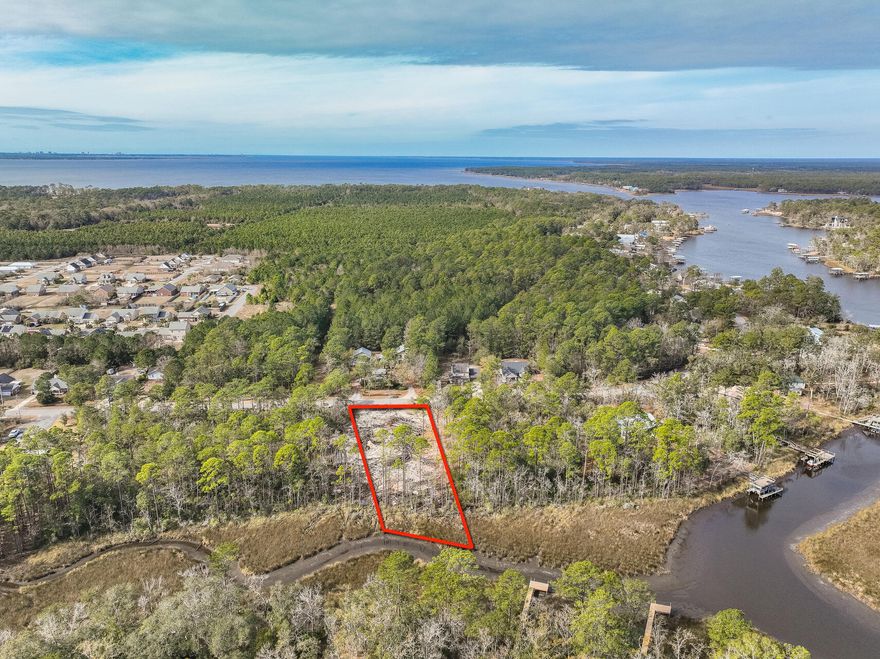 Grab this rare chance to own a waterfront lot on Mallet Bayou, ideal for building your dream home. Enjoy 90+ feet of beautiful water frontage, and a scenic mix of oak and pine trees - perfect for those who love being near the water. Conveniently located near U.S. Hwy 331 and a new county park with a boat ramp, this lot offers both tranquility and accessibility. Schedule a private showing to see the possibilities for yourself. Don't wait, this kind of lot doesn't come up often!