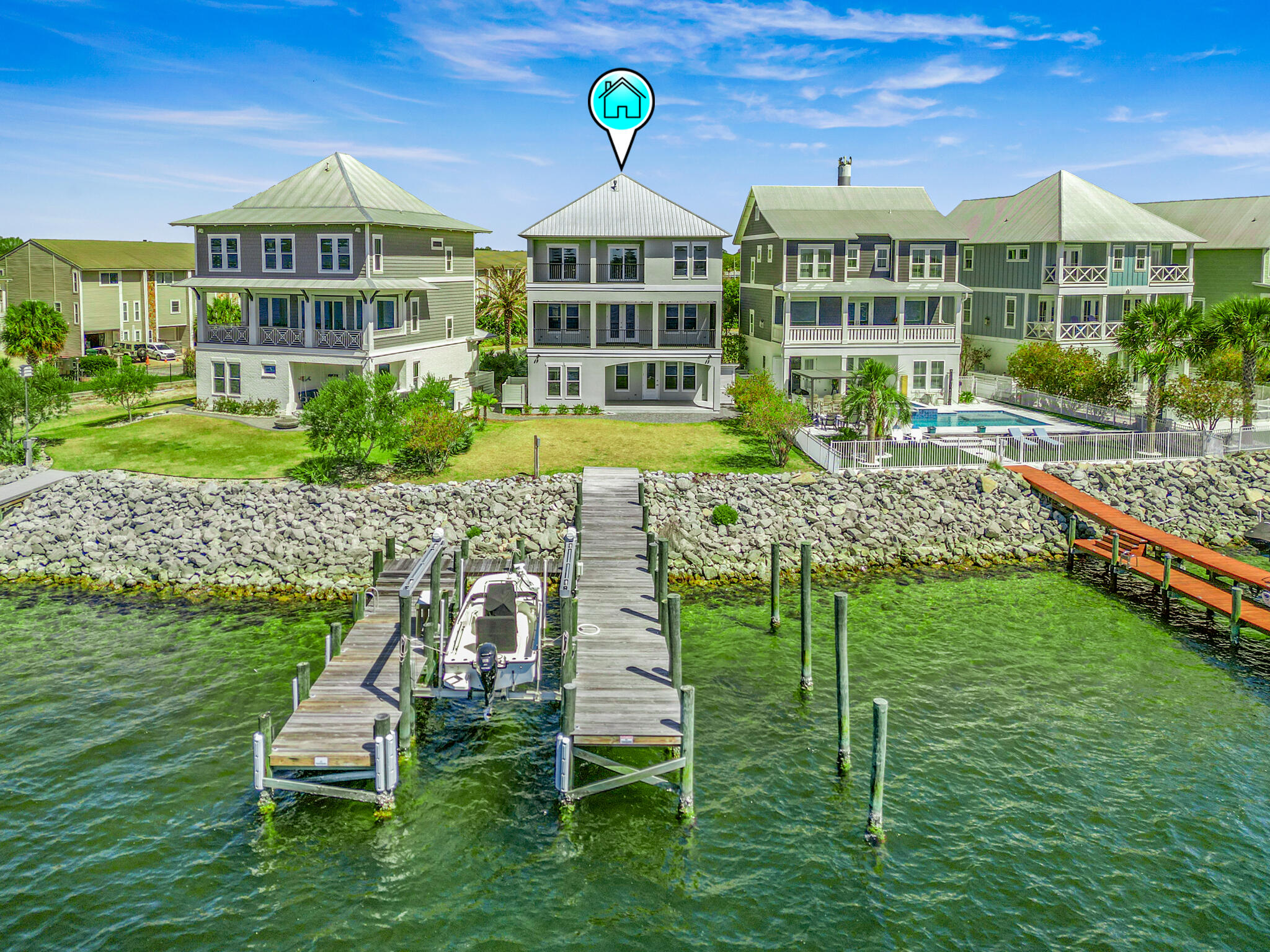 Welcome to The Pointe -- the crown jewel and final available bayfront home in this exclusive 9-lot coastal enclave. Perfectly positioned on a rare point, this custom-designed masterpiece offers uninterrupted panoramic views of the bay, where daily dolphin parades, sailing regattas, and passing fishing boats unfold right before your eyes. From your porch, you'll take in unreal sunsets and soak up cool summer sea breezes in one of the most temperate and peaceful settings on the Gulf Coast.Crafted for effortless indoor-outdoor living, this 4-bedroom, 3.5-bath home features four spacious porches, a cabana room, and a grand open-concept living area with soaring 10' ceilings that frame the water like art.Built to the highest standards with impact-rated glass, soundproof floors, open-cell foam insulation, and an elevator reaching all 3 floors!
Whether you're a boater, angler, or simply someone who craves a front-row seat to nature's daily show, this home is the ultimate expression of bayfront luxury living.