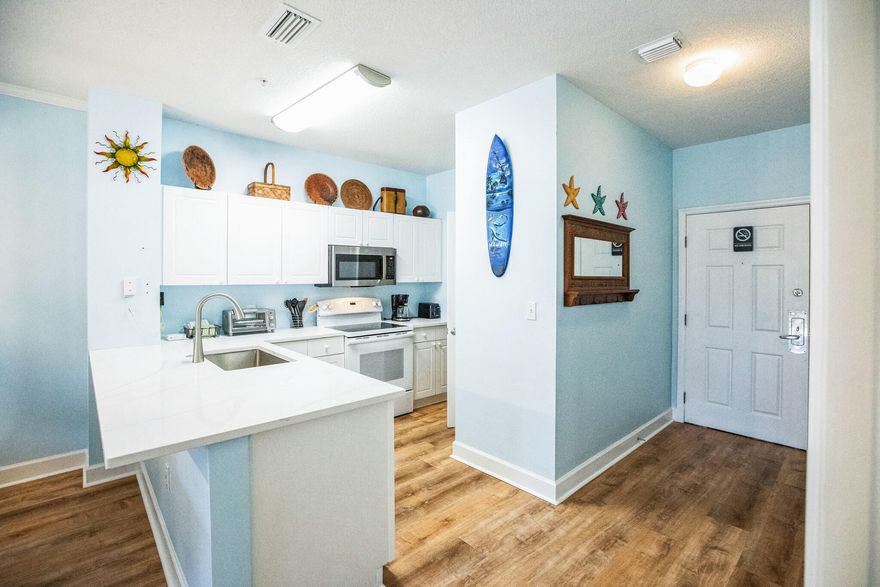 This Stunning highlly desirable  Emerald Waters Beachside  Condo update has deeded and direct beach access. Just walk right across the street to the Emerald Green waters and White Glistening Sand. This  updated 2/2 provides  a coastal ambiance that vacationers seek out.  Kitchen has new gorgeous quartz counter tops. Bathroom with new vanties and counter tops. New Luxury vinyl flooring throught!  New Bedroom furniture in both bedrooms, drapes and blinds and patio furniture .  Access to everthing fun is right here! This is a low density building with only 36 units and does  have elevators.Unit is self-managed.