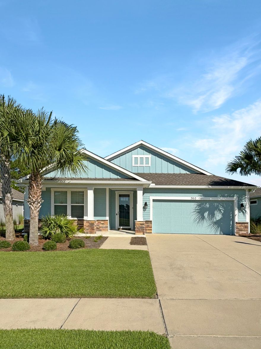 Nestled in the desirable Whisper Dunes community just over a mile from Panama City Beach's sugar-white sands, 360 Blue Sage Road is a beautifully designed coastal home built in 2017. This single-story residence spans 1,818 square feet with three bedrooms and two full baths, blending comfort and style in a thoughtful floor plan. The open living area welcomes you with neutral finishes and wood-look tile flooring that create a light, breezy atmosphere. The kitchen features granite countertops, stainless steel appliances, a large pantry, and a breakfast bar--perfect for both everyday living and entertaining. The spacious master suite offers a spa-like retreat with an oversized walk-in shower and generous closet space. Sliding glass doors open to a covered lanai with peaceful wooded views and a pond beyond. A retractable screen lets you enjoy the space year-round. The home also boasts a new roof and fresh exterior paint completed in 2023, plus modern conveniences like smart garage openers, automatic irrigation, and outdoor outlets prewired for cameras.
Set on a low-maintenance lot that backs to natural green space with no neighbors behind, this property offers both privacy and tranquility. Whisper Dunes enhances the lifestyle with sidewalks, a community pool, lush landscaping, and a covered cabana.
With its coastal charm, updated features, and close proximity to Pier Park, St. Andrews State Park, and the Gulf, 360 Blue Sage Road is move-in ready as a full-time residence or a serene beachside retreat.