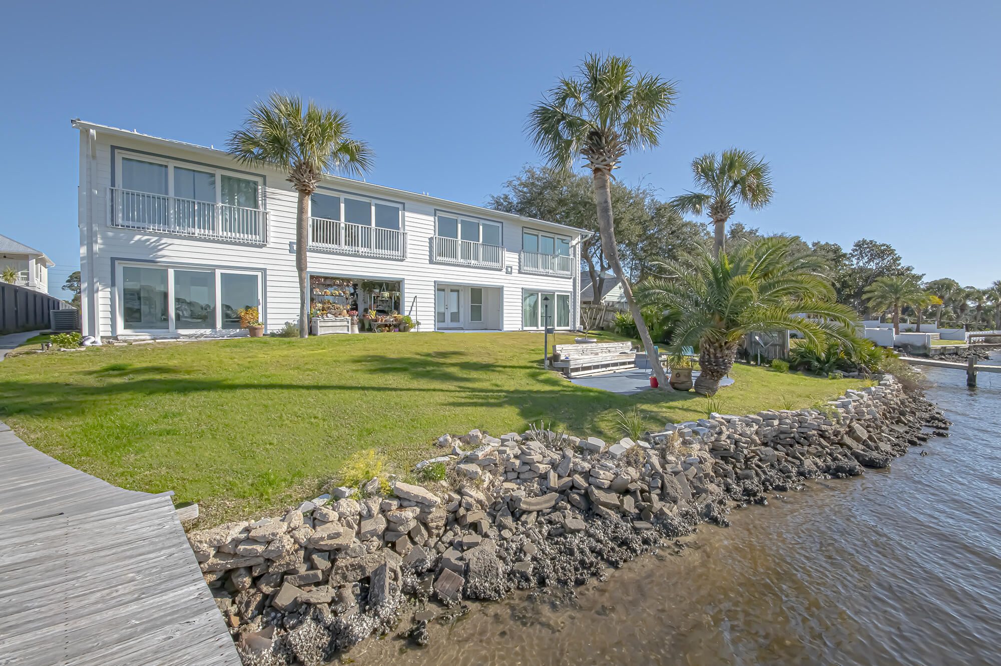 Come discover the beautiful views of North Lagoon with this wonderful waterfront condo. This condo features a fantastic Florida Room overlooking North Lagoon, and much more. Outside of course you have a great water front view with community pier and boat dock. Visit the East end of Panama City Beach and see what you have been missing, quiet, centrally located to shopping, Navy Base, schools and less than a mile to the world's most beautiful beach! Just minutes from some of the beach's best restaurants like Captain Anderson's, Grand Marlin, and Schooners. It is just a short boat ride from your dock to Shell Island and literally watch dolphins swim in your backyard! Call today for additional detail.