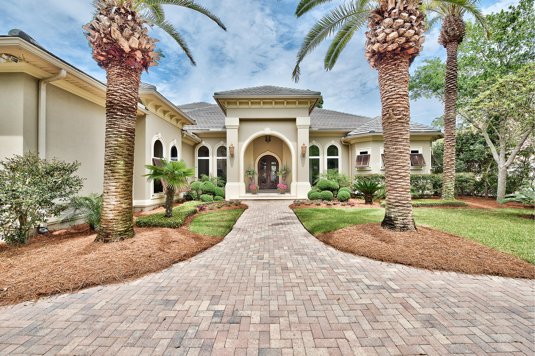 Beautifully situated along the immaculate manicured 5th hole of the prestigious Burnt Pine Golf Club with peaceful lake views, this captivating 4 bedroom, 4 bath Boswell built estate is a stylish balance of formality and comfort. A home created for entertaining, its dramatic public rooms open onto a grand covered outdoor living area with stunning wood ceiling, screened lanai and elegant infinity edge pool. The outdoor kitchen features fireplace, built-in TV cabinet, kegerator and ample seating space - perfect for lazy afternoons or hosting a BBQ. Inside, this glamorous home brims with one of a kind artisan touches with high ceilings, wide hallways and exquisite details with purity of materials and super refined finishes.