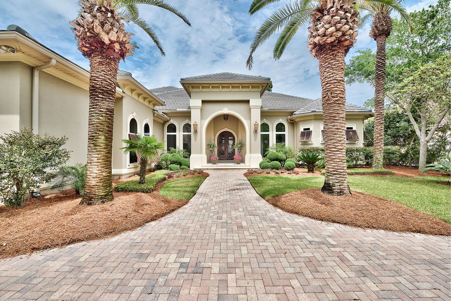 Beautifully situated along the immaculate manicured 5th hole of the prestigious Burnt Pine Golf Club with peaceful lake views, this captivating 4 bedroom, 4 bath Boswell built estate is a stylish balance of formality and comfort. A home created for entertaining, its dramatic public rooms open onto a grand covered outdoor living area with stunning wood ceiling, screened lanai and elegant infinity edge pool. The outdoor kitchen features fireplace, built-in TV cabinet, kegerator and ample seating space - perfect for lazy afternoons or hosting a BBQ. Inside, this glamorous home brims with one of a kind artisan touches with high ceilings, wide hallways and exquisite details with purity of materials and super refined finishes.