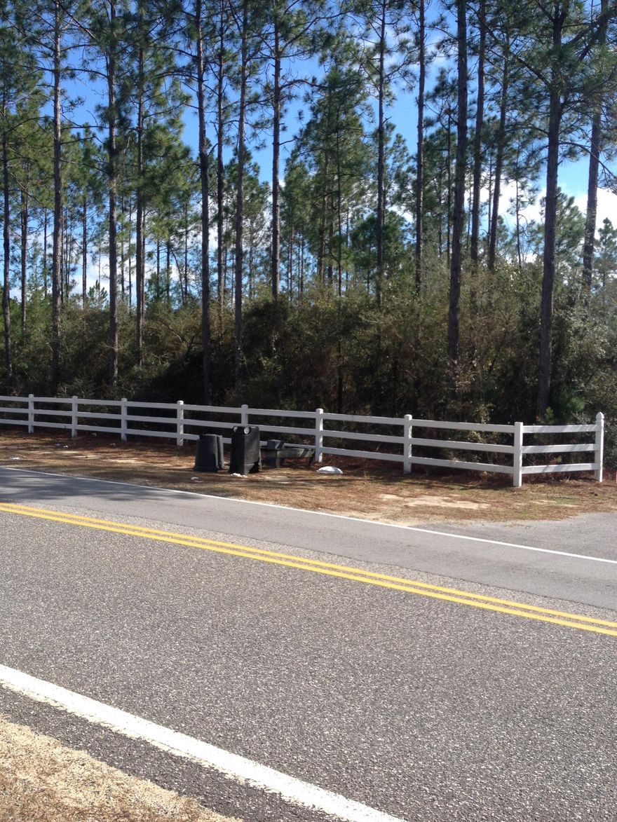 Nice 5+ acres on paved road and property is mostly wooded. Approx 1300 ft. into the lot, there is an area that has been cleared. This would make a great homesite. The driveway is shared between the two adjoining land owners. Only 10 minutes to DeFuniak Springs and 5 minutes to Freeport. Growing Areas in both Freeport and DeFuniak Springs!