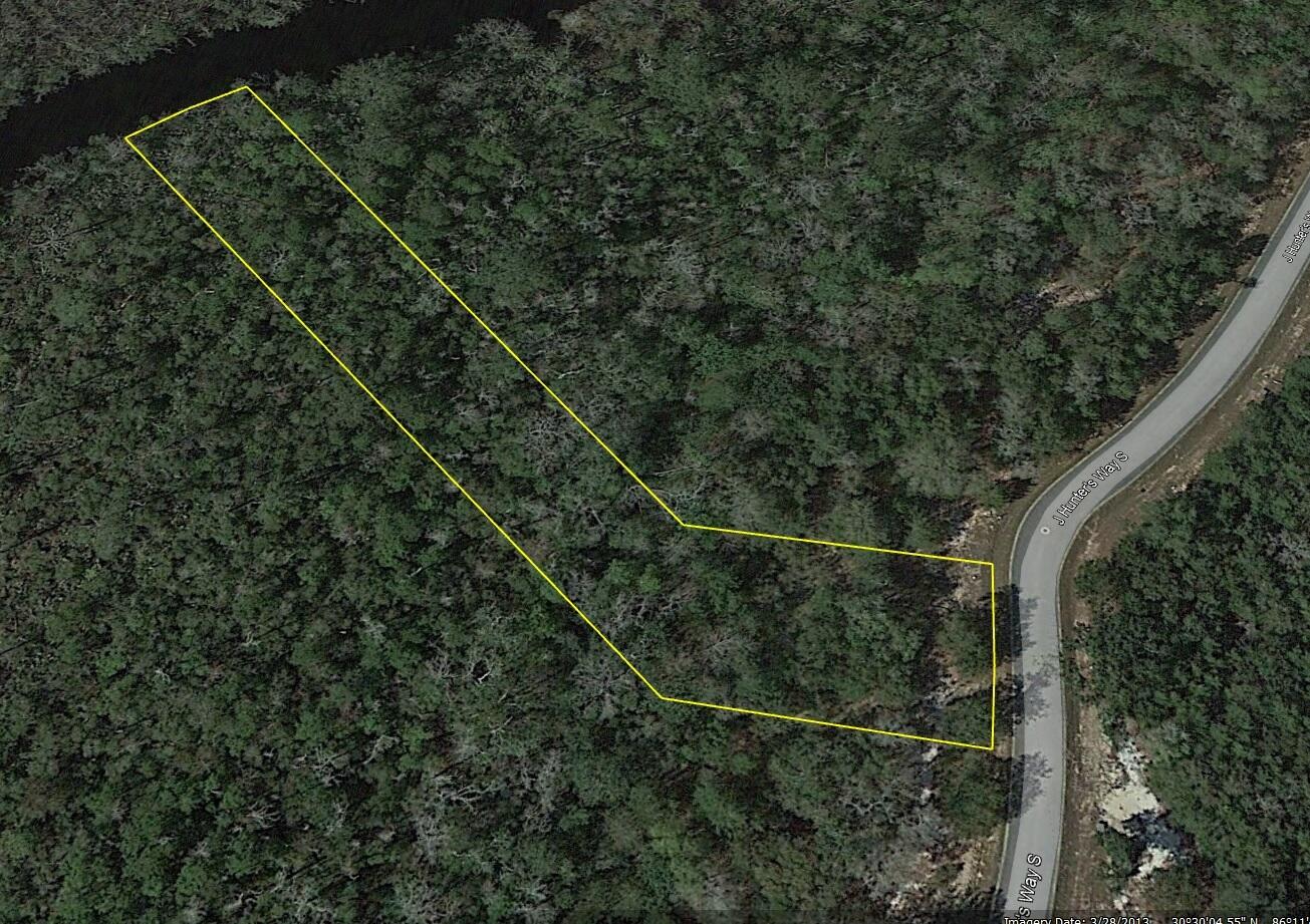 Beautiful estate size waterfront lot backing up to Godwin Creek in the gated community of Magnolia Bay Estates, a 79 lot subdivision of which 26 are waterfront, with access to Alaqua Bayou, Choctawhatchee Bay and the Gulf of Mexico. Conveniently located to the booming town of Freeport, Hammock Bay, shopping, restaurants and only 20 minutes to Hwy 30A and the crystal sandy beaches of the Gulf of Mexico. Water, sewer tap, and utilities are at site ready to build the house of your dreams. Additional waterfront lot is available. All Information is deemed reliable but not guaranteed with the buyer to verify. Seller financing with flexible terms is available with adjusted pricing. Craft two home sites for your family or keep the other lot as an investment. You must visit these properties in person to take in the beauty of the vista. Erect a dock on Goodwin Creek and launch your boat or drop a fishing line to while away the day and maybe catch dinner. Perfect Location, Exceptional Investment Opportunity. Situated in a quiet, tranquil neighborhood, these properties are investor's dream.
Convenience Amidst Nature's Best
Only 7-10 mins from downtown Freeport and close to the following points of interest:
Dining/Restaurants: 7-15 minutes - Bubba Jacks, Taco Bell, Waffle House, McDonalds, El Jacalito Mexican Restaurant, Dairy Queen Grill & Chill, Li's Hot Wok Chinese Buffet, The Oar House & Oyster Bar
Historical Landmarks/Parks/Recreation: 5-10 minutes - Old Town Freeport, The Heritage Center of Freeport, Harry A. Laird Park, Prospect Park, Riverwalk Landing Cottages & RV Park, Fisherman's Boatyard, Alaqua Watersports, Chain Dragon Disc Golf Course, Freeport Regional Sports Complex
Supermarket: 8-10 minutes - Publix
Beaches: 30 minutes - Blue Mountain Beach, Grayton Beach
Hardware and Auto Parts Stores: 10 minutes - Ace Hardware, O'Reilly Auto Parts, Advance Auto Parts, B & M Tire Center
Schools: 5-10 minutes - First Steps Learning Academy, Freeport Middle School, Freeport Elementary School
Storage Facilities: 6-12 minutes - Move It Self Storage, Freeport Mini Storage