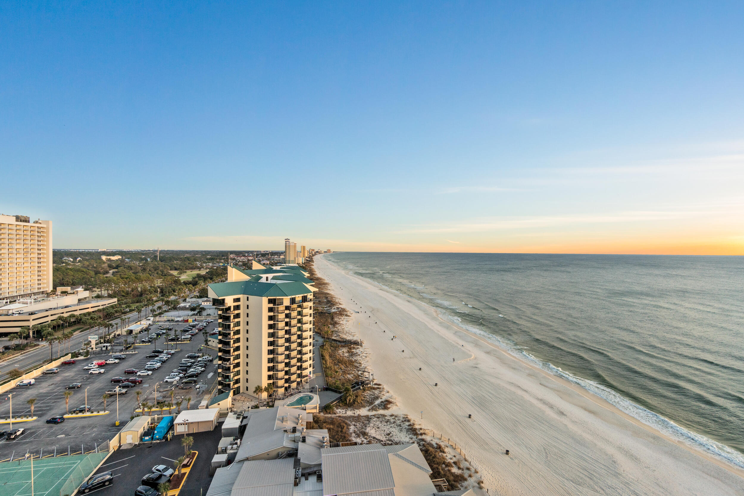 AMAZING 3 bed 3 bath east end corner unit with a wrap around balcony has unbelievable sunrise, sunset and coastal views. This highly desirable ''U'' floorplan has a gulf front master bedroom, gulf front living/dining area, beautiful kitchen w/ granite counter tops, tile throughout the entire condo and is being sold fully furnished and rental ready. The Shores of Panama is a tropical resort with amenities including a multi-million dollar 13,966 sq ft gulf front lagoon pool and a gulf front oversized hot tub, beautiful fountains and waterfalls, 2 tiki bars, and exotic tropical landscaping. Amenities also include a large indoor heated pool, indoor hot tub, on site full service spa with sauna and steam rooms, and covered parking (one assigned space)