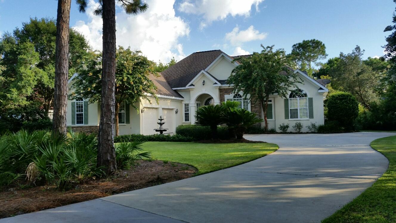 This home will captivate you the moment you see it! Set among sprawling oaks, majestic pines and the preserve you will experience privacy & nature at it's best. Offering 3 bedrooms, 3 baths with a layout designed for entertaining family & friends. All one level and the ideal size for retirement, small family or 2nd home. Inside, enjoy features like recessed lighting, crown molding, 8'doors, 10-13' ceilings, built in stereo speakers, beautiful screened veranda, gourmet kitchen, custom natural maple wood cabinets, granite counters, 2 gas fireplaces, Master suite with sitting room/office, large windows & french doors and new carpet! Enjoy Community amenities like Golf club, 18 hole Course, Security, Tennis courts, Owners Club & Pool, Fitness Center, Playgrounds and Owner events!