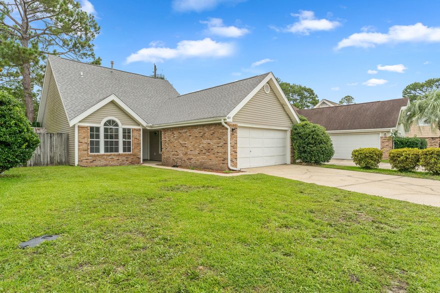 COZY HOME IN FORT WALTON BEACH! MINUTES FROM EGLIN AND HURLBURT AFB! Step inside to find new flooring throughout the entire home. The living area features cathedral ceilings, a fireplace, and an abundance of natural light. The kitchen has freshly painted cabinets, updated countertops and track lighting. Through the double doors rests the master bedroom with a private ensuite with double vanity and walk-in closet. The two additional bedrooms and bathroom offer plenty of space for the family. Spend your days inside enjoying your home or outside on the open patio in the privacy of the fenced in backyard. Schedule your showing today and let us welcome you home!!