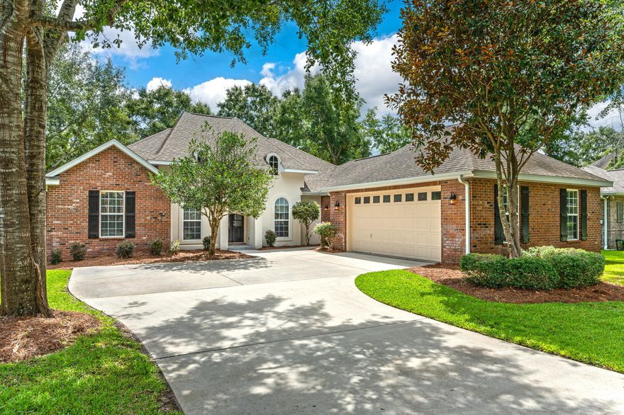 Situated in the quaint village of Claire's Vineyard, with its peaceful park-like setting, mature trees, sidewalks, streetlights and gated entrances for your privacy, this luxury custom built home is sure to appeal to buyers with the most discriminating taste.  As you enter the home through the impressive 8' tall arched door into the formal dining and living room area, you are greeted by elevated ceilings, gorgeous porcelain tile flooring and one of two gas fireplaces. The well equipped kitchen features stainless steel appliances, to include a Wolf gas stove, an abundance of cabinets and granite countertops.  Located directly off the kitchen is a cozy sitting room with its own gas fireplace.  The master suite is your own personal sanctuary with private access to the rear patio, a spacious walk-in closet, a large jetted soaking tub, separate shower and his & her vanities. Other amenities to make note of is the 24 KW air cooled standby whole house Generac generator (installed 10/2021), a sprinkler system to include a deep well lawn pump, and aluminum fencing in the back yard.   The homeowners have meticulously maintained the property and it is truly move-in ready.  A new roof and new gas water heater are in the process of being installed.  The HVAC system was replaced in April 2022 with a Trane 5-ton 14 SEER (gas furnace).  The 2-car garage has removable wind-load posts to reinforce the garage door during storms.  Conveniently located to shopping, schools, restaurants and movie theatre.