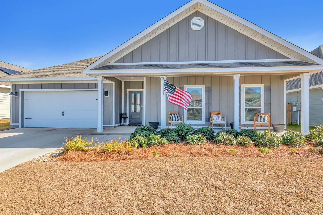 Welcome home to this charming 4-bedroom, 2.5-bathroom cottage-style home nestled in the Bridge Harbor Community close to Tyndall Air Force Base! As you step through the front door, you'll be greeted by 9' ceilings throughout the home. The living room and primary bedroom boast trey ceilings adding an extra touch of sophistication to these key spaces. The hallway leads you to three bedrooms, a well-appointed guest bathroom and a conveniently located laundry room to complete this section of the home. The heart of the home lies in the open-concept living room connected to the spacious kitchen featuring granite countertops, an undermount stainless steel sink in the center island, and a walk-in pantry for all your storage needs. The home showcases luxurious LVP flooring in the main area