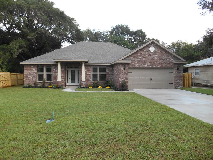 This is another quality new home built by an award winning VA approved builder in a convenient central Fort Walton Beach location. Many features that other builders call upgrades are included as standard features in this home. Features such as Granite Countertops, Designer Cabinetry with soft-close drawers, Porcelain Tile in the Wet areas, Tumbled stone back splash in the kitchen, Automatic irrigation system with a shallow well, GE Stainless Steel appliances, Tray ceilings in the Living Room and Master Bedroom, Covered Lanai with Ceiling Fan, Finished and trimmed garage with quiet belt driven garage door opener, Fabric Hurricane shutters for all windows and doors with exterior hardware pre-installed, Quiet Zone insulation for the Master Bedroom separates sound from the main living area.