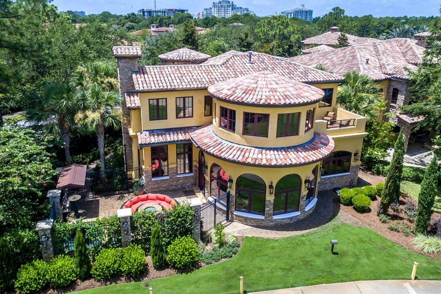 Exquisite detail in this unique, memorable, low maintenance Tuscan Villa in Sandestin. Located on the 12th fairway of Raven golf course, the spectacular views are maximized from window-wrapped circular rooms and beautiful outdoor living space. Ideal for entertaining large groups, this home has 2 large kitchens featuring granite counter-tops, custom cabinetry, Viking appliances, warming drawer, and breakfast bar. The second kitchen is equipped with a 13' commercial grade Twin Eagle tepanaki grill, Twin Eagle BBQ grill, and Twin Eagle 60,000 BTU burner with high grade Stainless Steel and LED lighting. The custom wine seller with cooling system would please any wine collector. Beautiful finishes include: natural stone and distressed wood flooring, custom wood doors and iron work, stone and marble fireplace, and custom faux finish paint throughout. Beautiful upstairs master suite with spacious circular "Florida room" with private balcony, piano room, and large walk in closet.  In addition, this home features a whole house generator, Sonos sound system throughout, digital LED lighting system, 3 dual-compressor high efficiency A/C units, 4 fireplaces, piano room, and more. Sandestin Golf and Beach Resort is named the #1 resort on Florida's Emerald Coast.  Spanning over 2,400+ acres, this resort is comprised of over 70 unique neighborhoods of condominiums, villas, town homes, and estates. The resort features miles of sandy white beaches, four championship golf courses, a world-class tennis center with 15 courts, 4 resort swimming pools (and 15 private neighborhood pools), a 113-slip marina, a fully equipped and professionally staffed fitness center and spa, meeting spaces and The Village of Baytowne Wharf, a charming pedestrian village with events, shopping, dining, and family entertainment. 