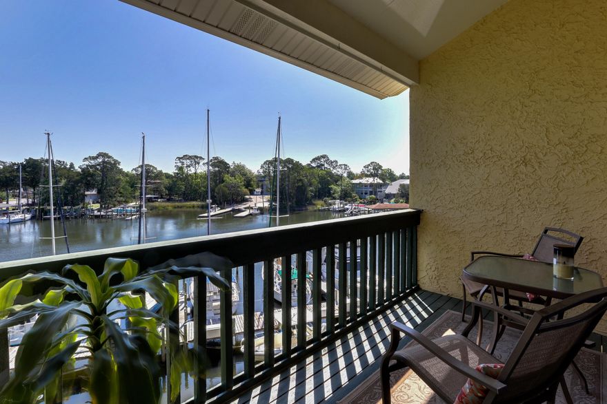 Immaculate waterfront 3 bedroom, 2 bathroom condo available in the desirable Bluewater Bay neighborhood. The primary unit features 2 bedrooms, a full bathroom, washer/dryer, walk-in-closet, full kitchen with large breakfast bar, spacious living and dining room, loft space and screened-in balcony. The secondary unit is a studio with a full bathroom, kitchenette with small bar, and large private balcony. The secondary unit is being sold fully furnished: immediately ready to rent out as an income property! Roof was replaced in 2018-2019, new AC unit in the secondary unit 2019, updated loft railing in the primary unit 2020, renovated bathroom and kitchen floor in the primary unit 2021, and freshly painted throughout. Both units have beautiful water views overlooking Bluewater Bay Marina are