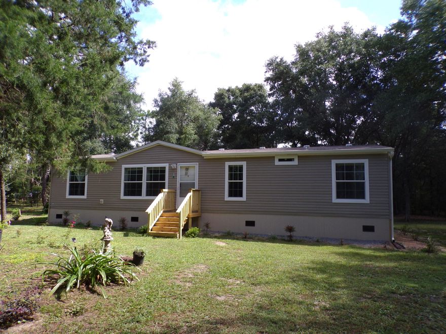 Looking for privacy and seclusion while still being within minutes of town? This 2017, 3 Bedroom 2 Bath home is located in the King's Lake area, less than 10 minutes to downtown DeFuniak Springs. Sitting on 3.8, mostly  wooded, acres this home is barely visible from the road, you can't see your neighbors and Martha Lane is  a dead end street, with this home being almost at the end! There is plenty of room for horses, chickens, a garden, etc. and the property is already fenced and cross-fenced. There is a small shed with lean to for storing your lawn equipment. The property has been surveyed into two different parcels for the possibility of a future split (must check with planning department). The home isn't available for move in until December, but you can schedule your showing today