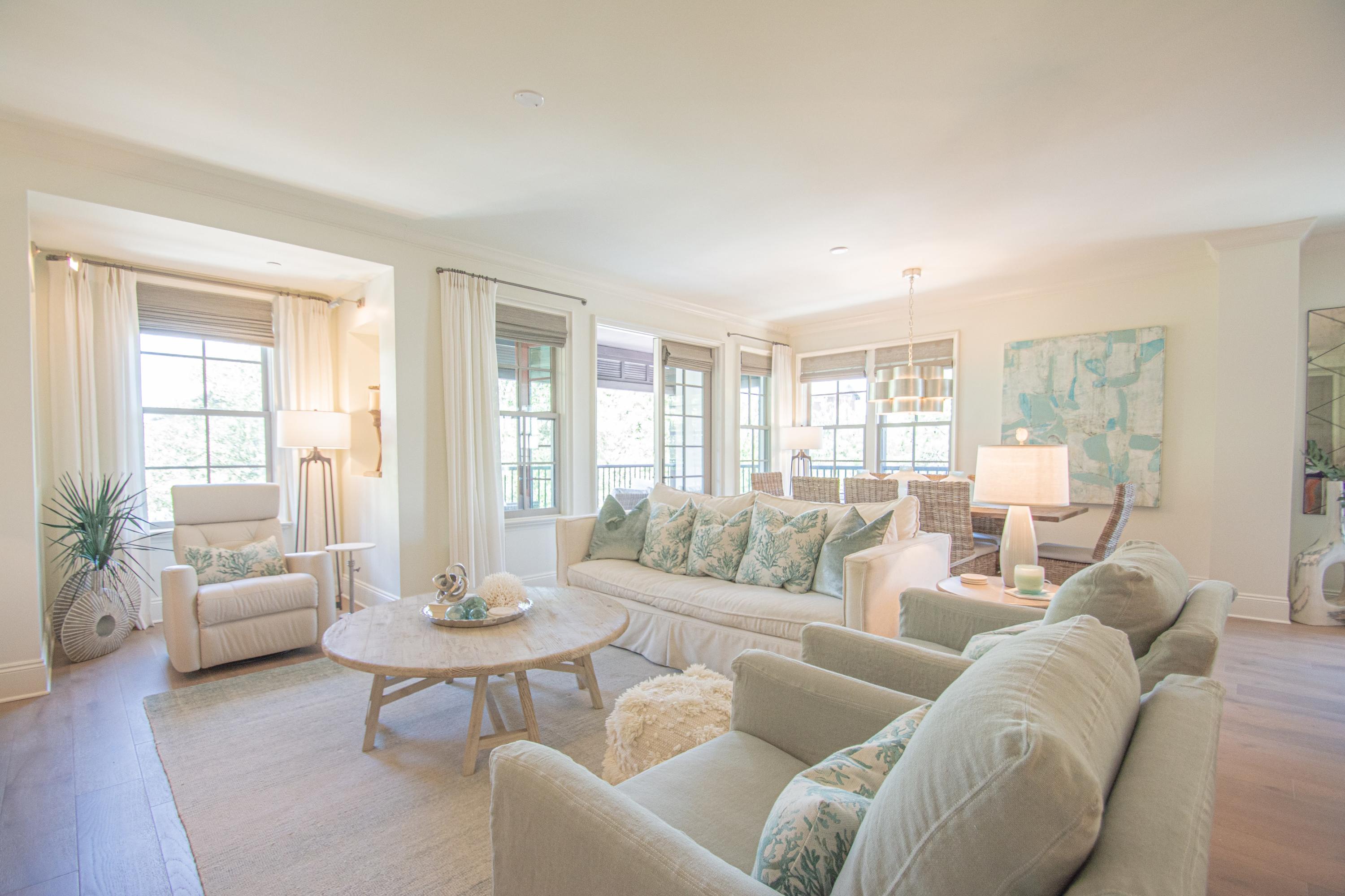A Classy Beach Condo, the Georgetown Unit 202 features the soft sea blue greens that epitomize beach decor and imbibe the relaxed calm of beach living. Enjoy direct access to Rosemary Beach Town Center as well as the benefit of this particularly private corner unit. The gracious entry and wide corridor to the open living, dining and kitchen area host French doors to a spacious balcony with an alfresco dining and conversation grouping. The master bedroom with ensuite luxurious bath also extend off the living area in a separated position to the guest bedrooms. This master also hosts it's own balcony. Two guest bedrooms and a bunk room have entries off the wide corridor. The guest room with an ensuite bath also acts as a junior master. The other guest room and bunk room share a full bath.