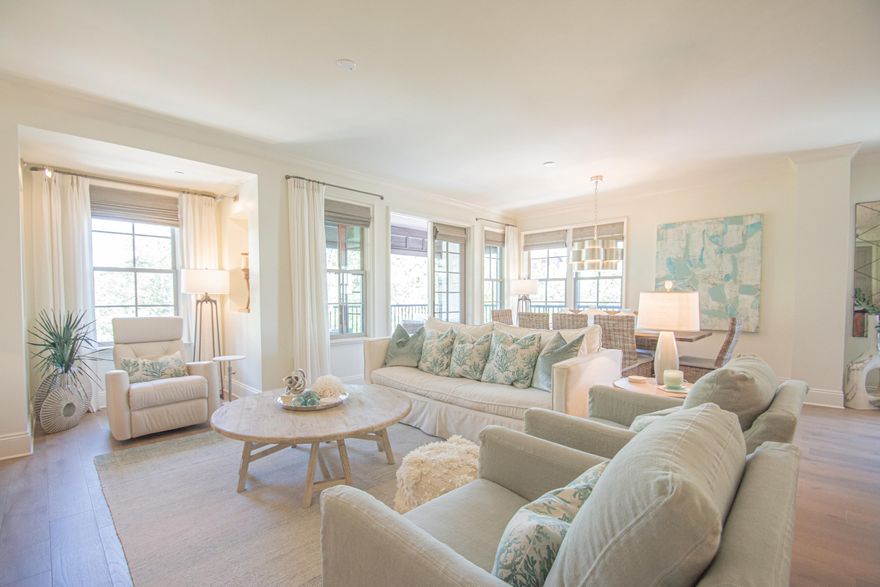 A Classy Beach Condo, the Georgetown Unit 202 features the soft sea blue greens that epitomize beach decor and imbibe the relaxed calm of beach living. Enjoy direct access to Rosemary Beach Town Center as well as the benefit of this particularly private corner unit.  The gracious entry and wide corridor to the open living, dining and kitchen area host French doors to a spacious balcony with an alfresco dining and conversation grouping. The master bedroom with ensuite luxurious bath also extend off the living area in a separated position to the guest bedrooms. This master also hosts it's own balcony. Two guest bedrooms and a bunk room have entries off the wide corridor. The guest room with an ensuite bath also acts as a junior master. The other guest room and bunk room share a full bath.