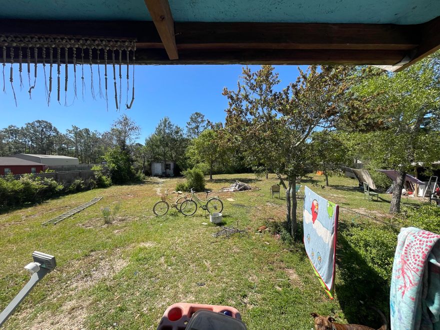 Cash Buyers... Investor's dream property! This 3 bedroom 2 bath home (year 2005) is located only  a short drive to the beaches, restaurants, and shopping in Navarre, FL. The lot is .46 acres and there is plenty of room for a pool, RV parking, and work trailers! There are two sheds (12x12 and 10x8) and the yard is fenced. The home needs some TLC but has great bones! Remodel this home or put a new home on this lot! Buyer to verify all dimensions and information! Purchase the lot and build a new home! There are many possibilities!