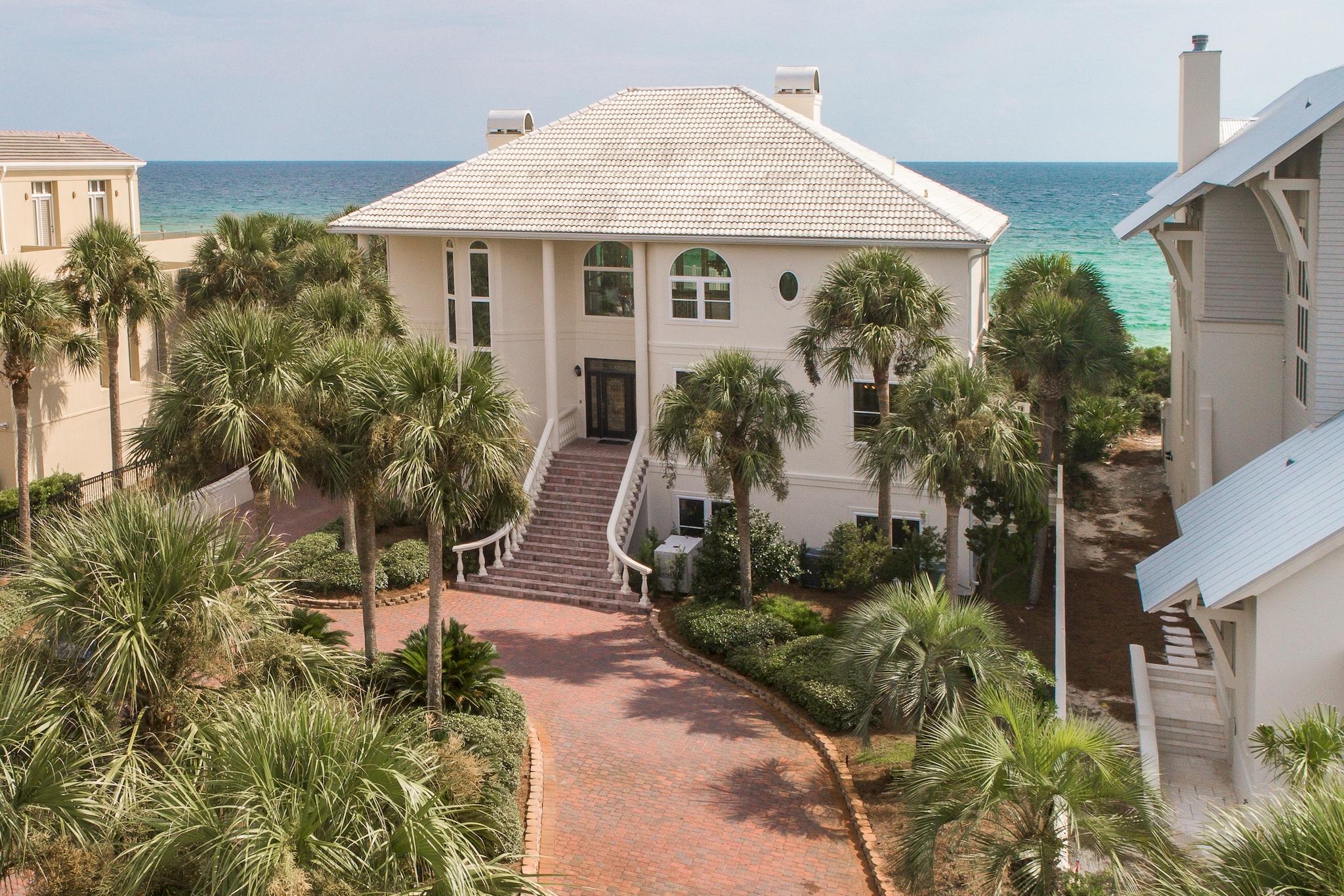 This magnificent Gulf front home in the exclusive gated Gulf Dunes subdivision of Scenic 30A is sure to impress. Enjoy plenty of open space as this estate property is 5,729 sq ft and situated on a huge lot with ~85 ft of gulf frontage and 370 ft of depth. The home features 4 bedrooms offering two Gulf front bedrooms on the first floor, a large Gulf front Master bedroom on the second floor, and a bedroom on the ground floor, 4 baths, and a spacious office that could be converted into a 5th bedroom. In addition there are very large Gulf front balconies maximizing the views, private boardwalk, gulf front pool and hot tub, fireplaces, custom kitchen, a generator that serves the entire home, enormous 4 car garage and new elevator that services all three floors. Home appraised for $4,955,000.