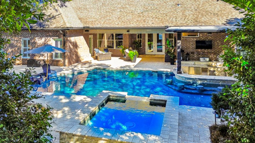 Your own private backyard retreat with ASSUMABLE 2.75% VA MORTGAGE for qualified buyers! Your secluded oasis is accessed through a covered lanai and features a resort-style saltwater pool with a hot tub, sun shelf and a swim-up bar serviced by a sunken outdoor kitchen. Enjoy a lifestyle of luxury and leisure with this exceptional 4-bedroom, 3-bathroom Single Level, Swift Creek Plantation home. Designed for those who love to entertain, the home features a spacious open floor plan that seamlessly connects the high-end kitchen, living & dining areas. Work with ease from the dedicated private office and host meals in the formal dining room. This meticulously maintained property is rounded out by a 3-car garage, high-quality finishes, landscape lighting & lush landscaping for maximum privacy. Pool has a gas heater for rapid heating and a heat pump for year-round temperature maintenance so the pool and hot tub are ready for enjoyment in any season. 

Large primary suite with private lanai access, jetted tub, separate shower and generous closet.

Two roomy bedrooms share one hallway bath; fourth bedroom with its own adjacent bath and private lanai access can be closed off as an in-law, teen or guest suite. 

Custom built cabinetry, 5'' crown molding and upscale fixtures 

Bosch appliances to include combo microwave/convection oven.  The chef can entertain over the granite-topped eat-in bar or connected eat-in kitchen.  2025 LG Craft Ice Smart Wi-Fi four-door refrigerator.

A well-equipped laundry room with oversized fiberglass sink and convenient custom cabinetry.

Outdoor shower with hot/cold watergreat for rinsing off and washing pets!

Swift Creek Plantation has a voluntary HOA with an annual fee of $100 for maintenance of common areas.

Assumable VA loan at 2.75% for qualified veterans.

Note: Grass in photos is edited to match summer condition, twilight photos are edited but reflect existing landscape lighting.

Buyer to verify anything deemed important including, but not limited to, lot size, school zones, room dimensions and sq/ft.  