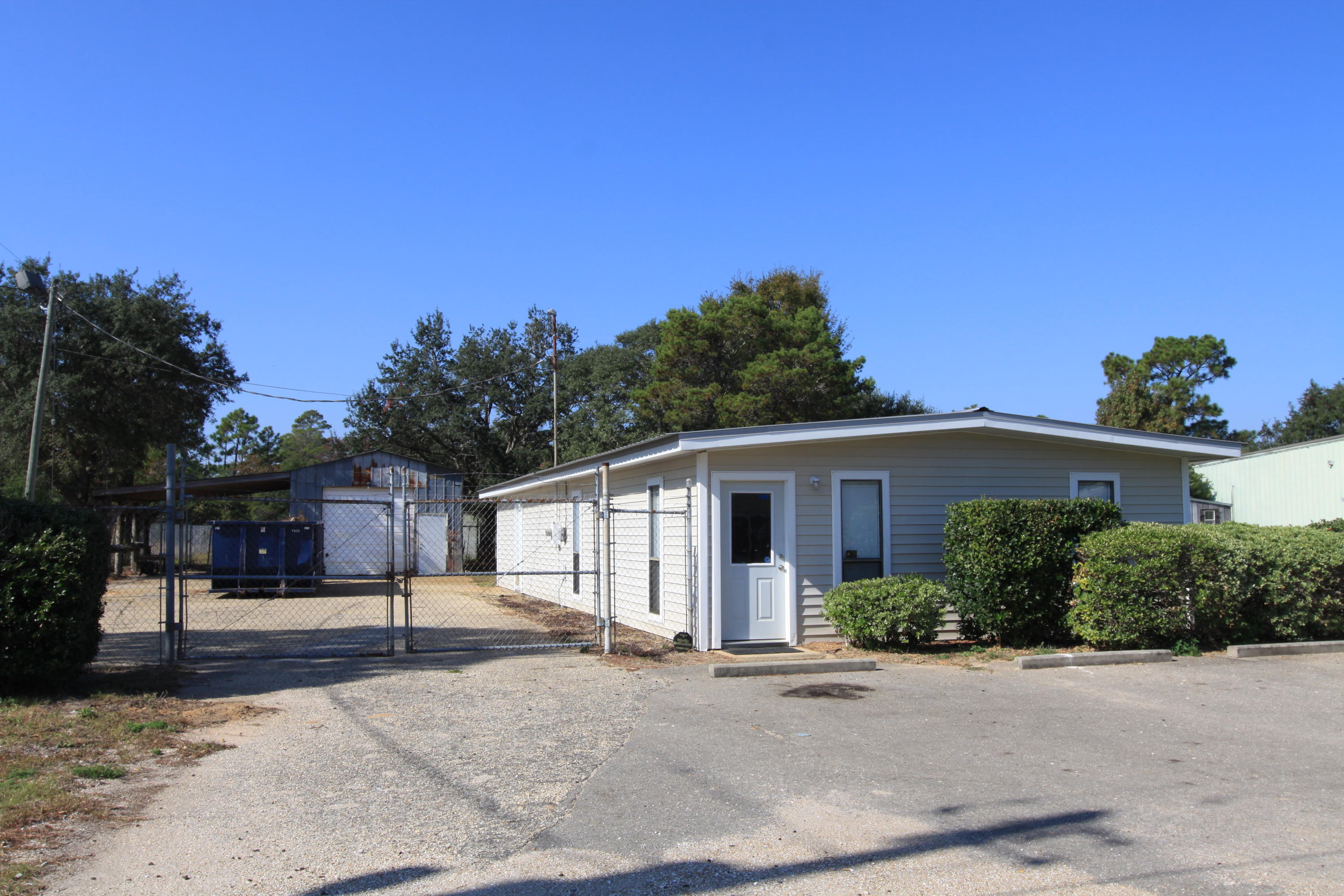 Great office for a service related business. The office building consists of 3 large offices, one smaller office, reception area, large conference room and a full kitchen. The sale also includes a 575sf warehouse as well as a 575sf covered work area in a fenced yard. Additional land available for lease or purchase if needed.