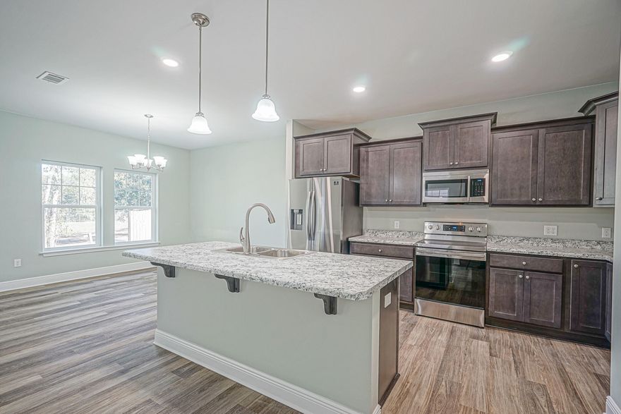 Brand new construction just passed I10 to be completed by Fall 2021! Walk in to an open concept kitchen, dining, and living room area with laminate flooring throughout. A perfect place to host the big game or a party! The kitchen has a large island with stainless appliances. The downstairs also has a half bath for your guests. Head upstairs where you will find four spacious, carpeted bedrooms, two tiled bathrooms, and a laundry room. Both bathrooms maintain a shower, bath tub combo with double sinks and Formica countertops. The master bathroom also includes a walk-in closet. The home features a two car garage and a small, covered patio in the back yard. The yard is completely fenced for privacy. This home is just around the corner from Publix and Chic-Fil-A!Please note the photos are