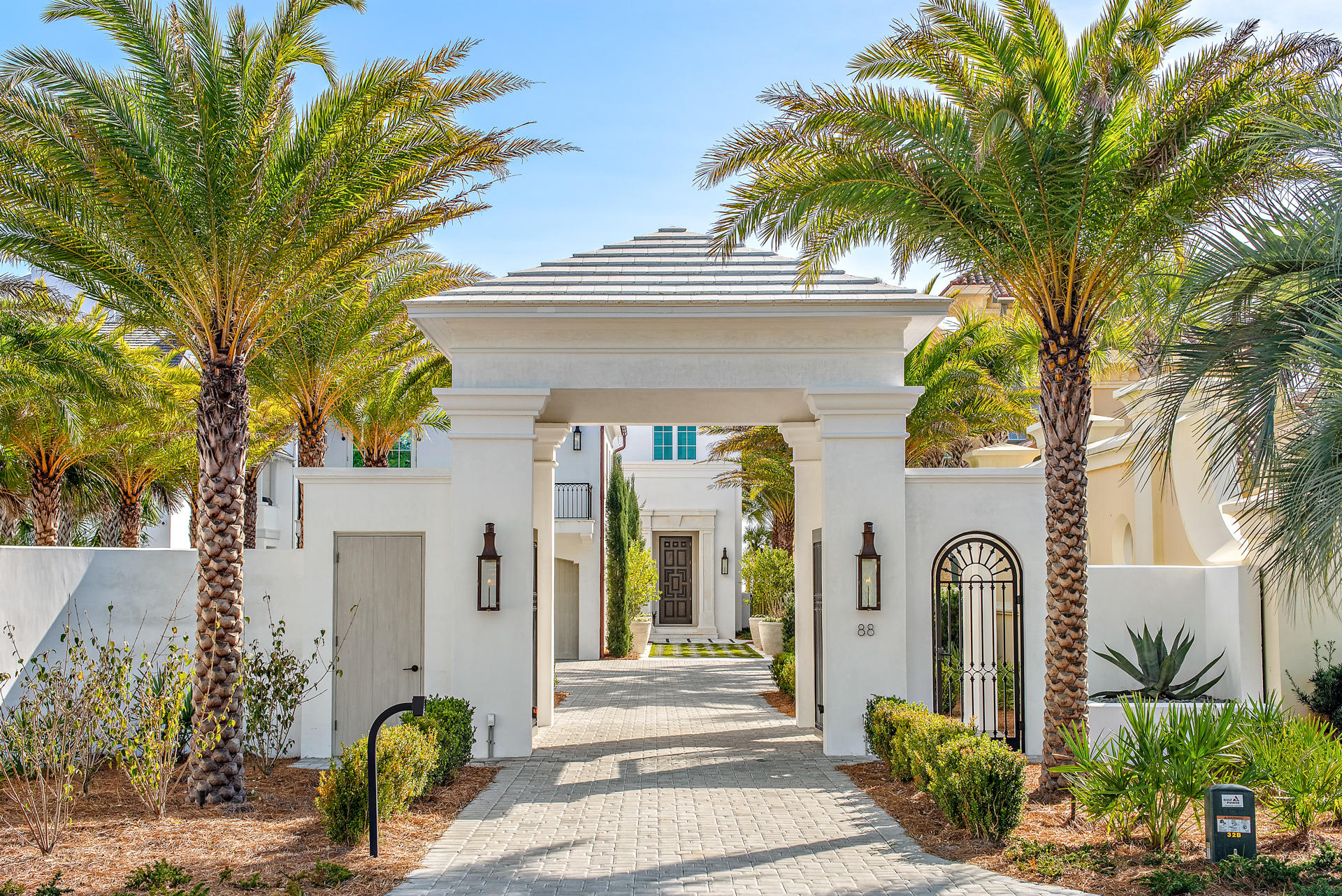 WELCOME TO PARADISE. This gulf front estate is a masterfully designed custom home by architect A BOHEME Design, interior designer Melanie Turner Interiors, and landscape architect Kendall Horne. Constructed by EarthBuild in 2019, this 9,790 square foot masterpiece includes eight bedrooms, nine and a half bathrooms, a separate guest house, two private pools, a residential elevator, two primary suites and impressive views of the stunning turquoise waters of the Gulf of Mexico.