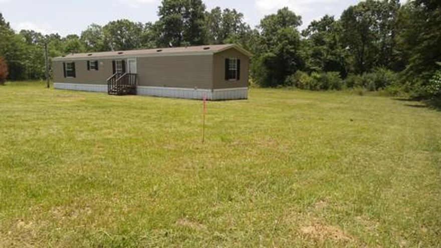 The inside of this mobile is like NEW! This home would make a great investment or family home. It is situated on 1 acre. The mobile home is 14X66 and 924 square feet. Financing available through seller with approved credit.