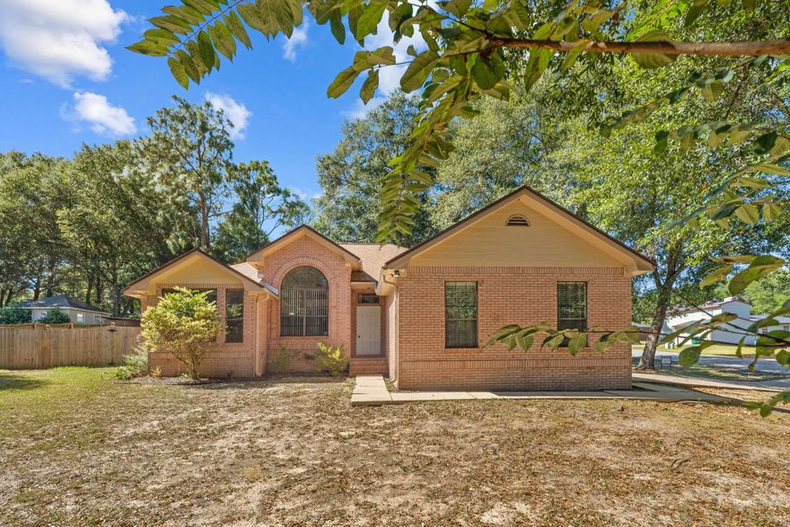 All brick 3 bedroom, 2 bath on large corner lot just minutes from schools and shopping~ Split floor plan, with wood burning fireplace.~ Large privacy fenced backyard~ Florida room has tile flooring, carpet in bedrooms~ Kitchen with plenty of cabinets and pantry~  Laundry room has cabinets and tile flooring~ Master bath has double vanity  & walk in closet~ Large Oaks grace the yard~ New roof installed March 22,2023~With an acceptable offer Seller will give buyer $10,000 carpet and paint allowance.