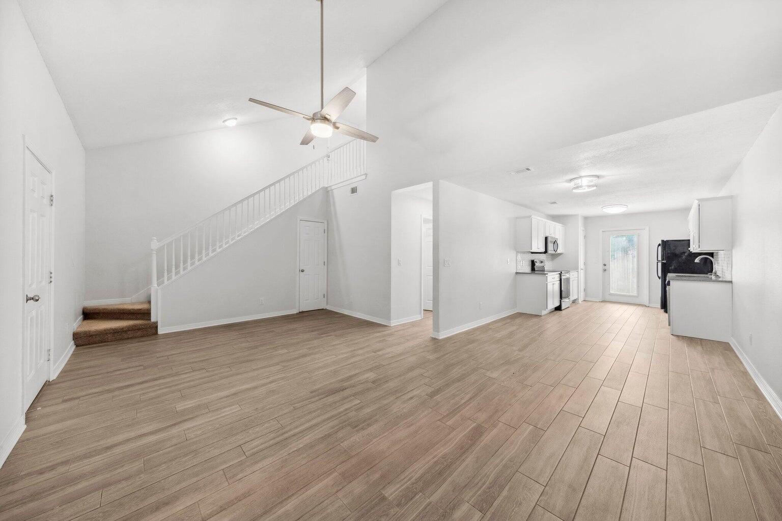 Welcome to this inviting 3-bedroom, 2-bath townhome, featuring a spacious master bedroom conveniently located on the first floor. Upstairs, two additional generously-sized bedrooms share a well-appointed bathroom, providing comfort and privacy for all. The kitchen is a chef's delight, boasting white shaker-style cabinets, elegant gray granite countertops, and a stylish tile backsplash. It opens seamlessly to the living room, which is graced with durable wood-like tile flooring throughout the downstairs. A one-car garage adds to the practicality of this home, which is ideally situated close to shopping, military bases, and the beautiful Emerald Coast beaches. This townhome combines modern amenities with a prime location for a perfect blend of convenience and coastal charm.