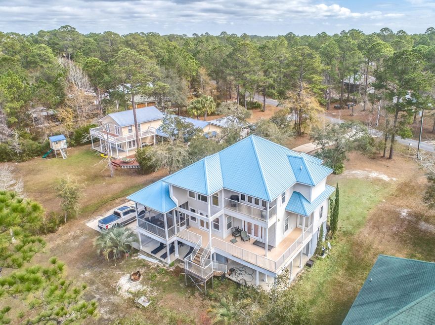 WATERFRONT home directly on beautiful Mallett Bayou! Step outside your back door and go kayaking, paddleboarding, or even crabbing! A boater's and fisherman's dream, you can be out in the Bay in 5 minutes! Enjoy peaceful and quiet living surrounded by nature- watch pelican and herons land on the water and feel the breeze as you relax on your dock or on one of the home's several balconies. Centrally located to the growing city of Freeport, and within minutes to the beautiful, white, sandy beaches of South Walton County. This home is situated on almost 1 acre, away from the hustle and bustle but close to it all.
