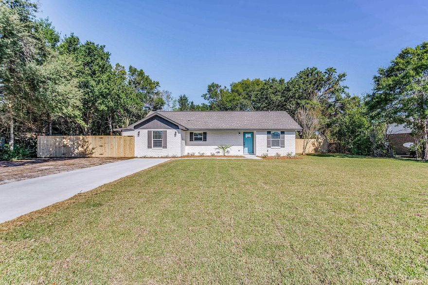 Located on a large lot in Bal Alex Estates, this completely renovated home offers a NEW ROOF, NEW HVAC and new gas water heater. The brick exterior has been freshly painted with new window treatments as well as all new sod, landscaping, sprinkler system and brand new privacy fence with a double gate ideal for boat or RV storage. The freshly poured concrete driveway also has a side drive that leads to a detached 1 car garage/workshop (with power) and an additional carport making for the prefect place to store a classic car, jet skis or motorcycle. Inside, you'll enjoy the gorgeous completely renovated kitchen with soft close cabinetry providing ample storage space (with a lazy Susan), new stainless appliances, fridge with ice and water dispenser, wall oven and electric cooktop. The gorgeous Dolomite "Fantasy Brown" counter tops and tile backsplash compliment the cabinetry perfectly. Just off the kitchen is a large den or dining area. The spacious living room provides ample space for the whole family. Both bathrooms have been completely renovated with gorgeous tile. The primary bathroom has a walk-in shower and the second bathroom has a shower/tub combo. All new paint throughout including doors and trim with new laminate flooring, all new light fixtures and fans and all new door hardware. Other notables are large laundry room with side door to back yard, new concrete lanai, recessed lighting, new front and back doors, new baseboards and blinds throughout. Located 1.5 miles to Wal-Mart, Lowes and Publix, 9 miles to Pensacola Beach and 22 miles to Hurlburt Field. Check out our full video tour on the MLS and YouTube.