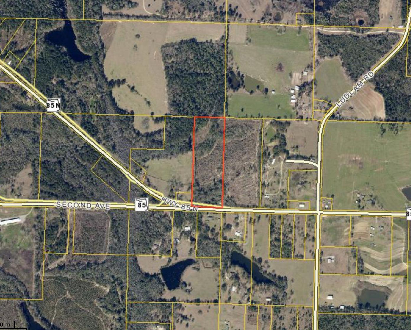 Level 12 Acres of Land 1.75 miles North, just outside of Laurel Hill. There is an existing structure on the East property line that is given no value. Please verify zoning, school zones, and other information that is important to you.